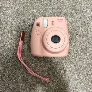 Pink Polaroid camera. Instax mini 8.